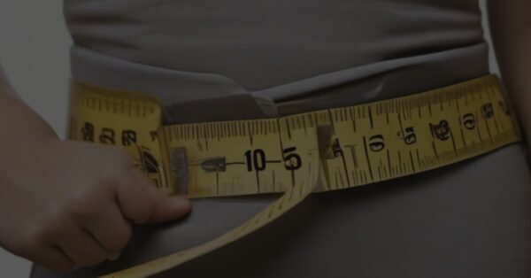 Measuring tape around waist wieht loss